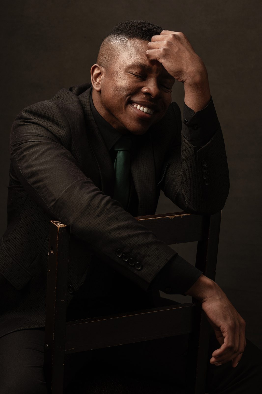 Thuba Myeki laughing during a studio shoot